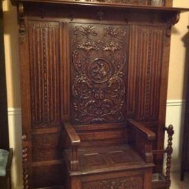MaxSold Auction: This auction features antique rocking chair with footstool, antique court cupboard, antique hall tree with storage bench, antique Belgian confessional, two glass chandeliers, and children's furniture!